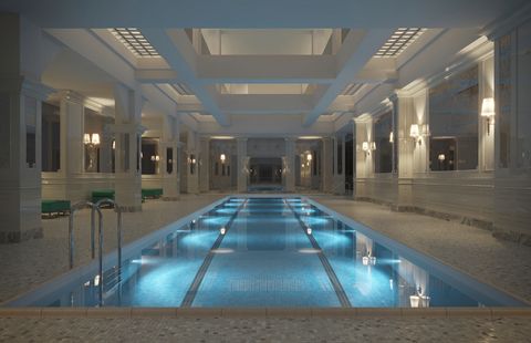 Langer Innenpool in einer großzügigen Halle mit weißen Säulen, Marmorverkleidungen und indirekter Beleuchtung. Das Wasser ist blau beleuchtet und spiegelt die Architektur des Raumes. Lap_Pool_credit_Visualisation_One.jpg