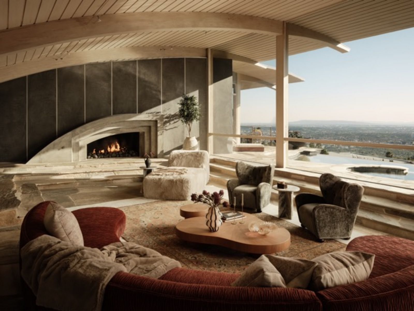 Großzügiges Wohnzimmer mit geschwungener Sitzlandschaft, Kamin und bodentiefen Fenstern. Durch die offene Glasfront fällt der Blick über einen Poolbereich und die weitläufige Stadtlandschaft im Hintergrund  Mittel__2-624_Cole_Pl_-_Nils_Timm_.jpeg
