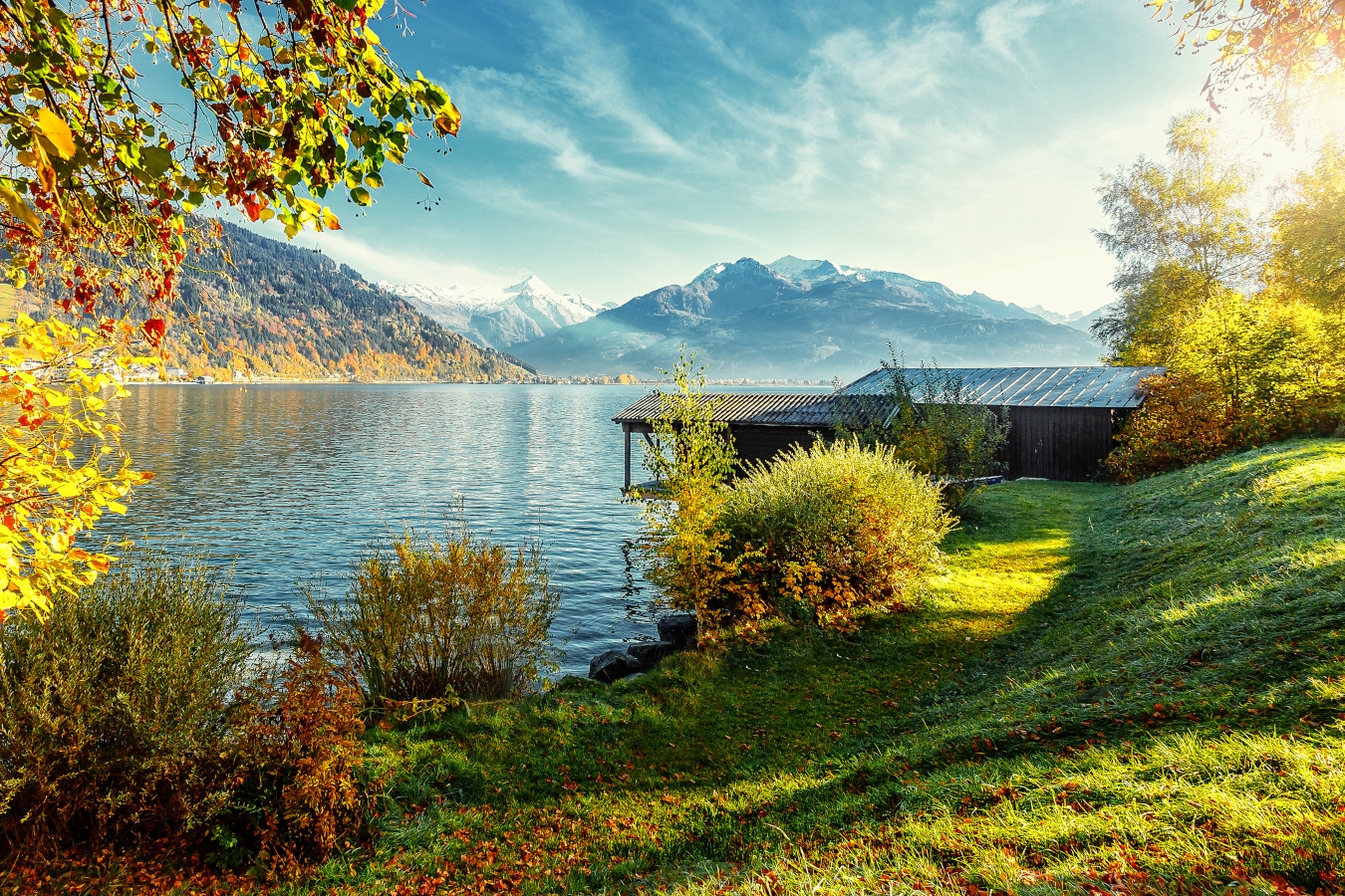 Landscape with Alps and Zeller See in Zell am See, Salzburger Land, Austria. Beautiful Sunny day in Alps. wonderlust view of highland lake With autumn trees under sunlight and perfect sky. AdobeStock_331265926_jenyateua.jpeg